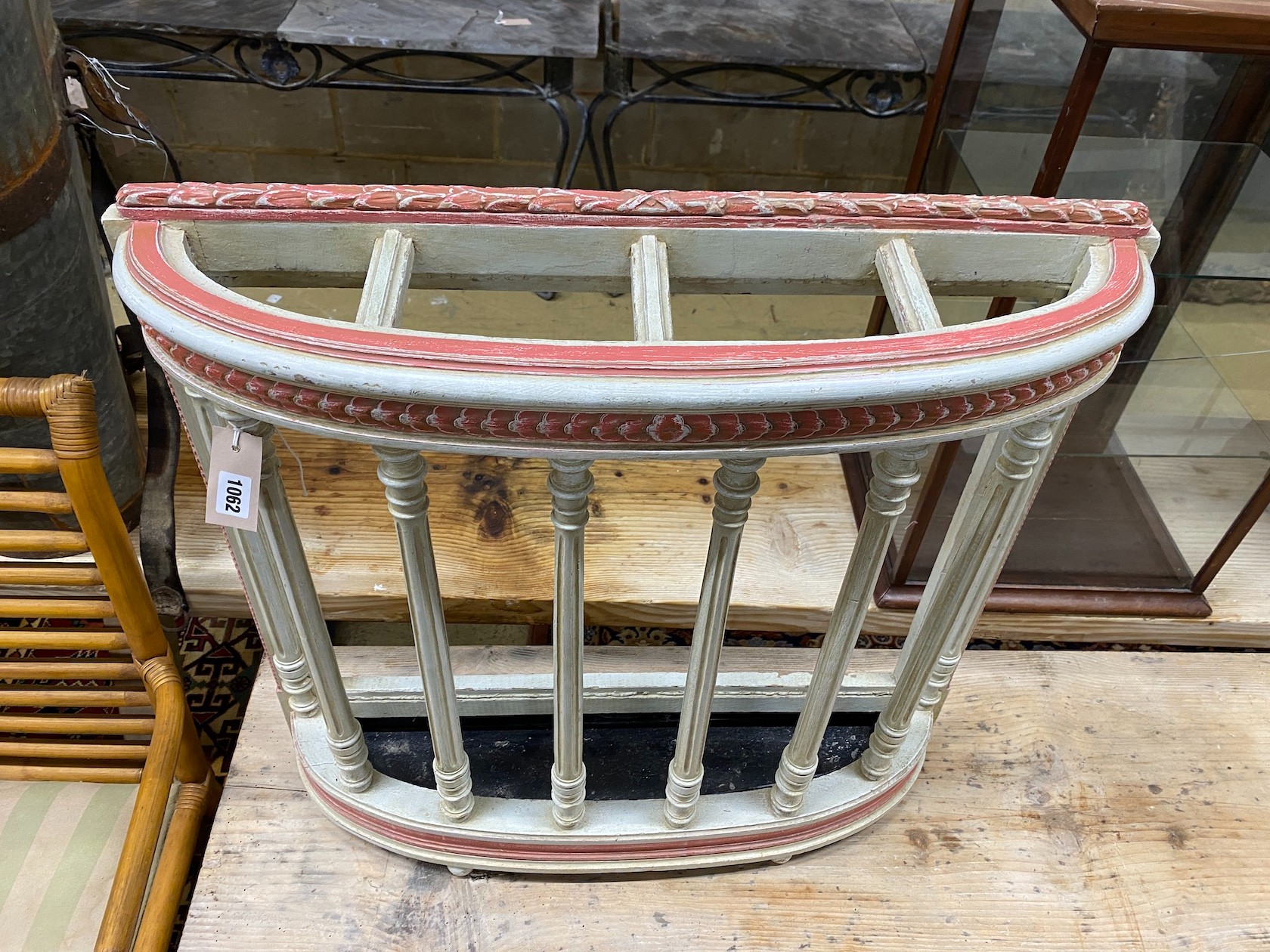 An early 20th century French painted four division stickstand with drip tray, width 73cm, depth 19cm, height 70cm
